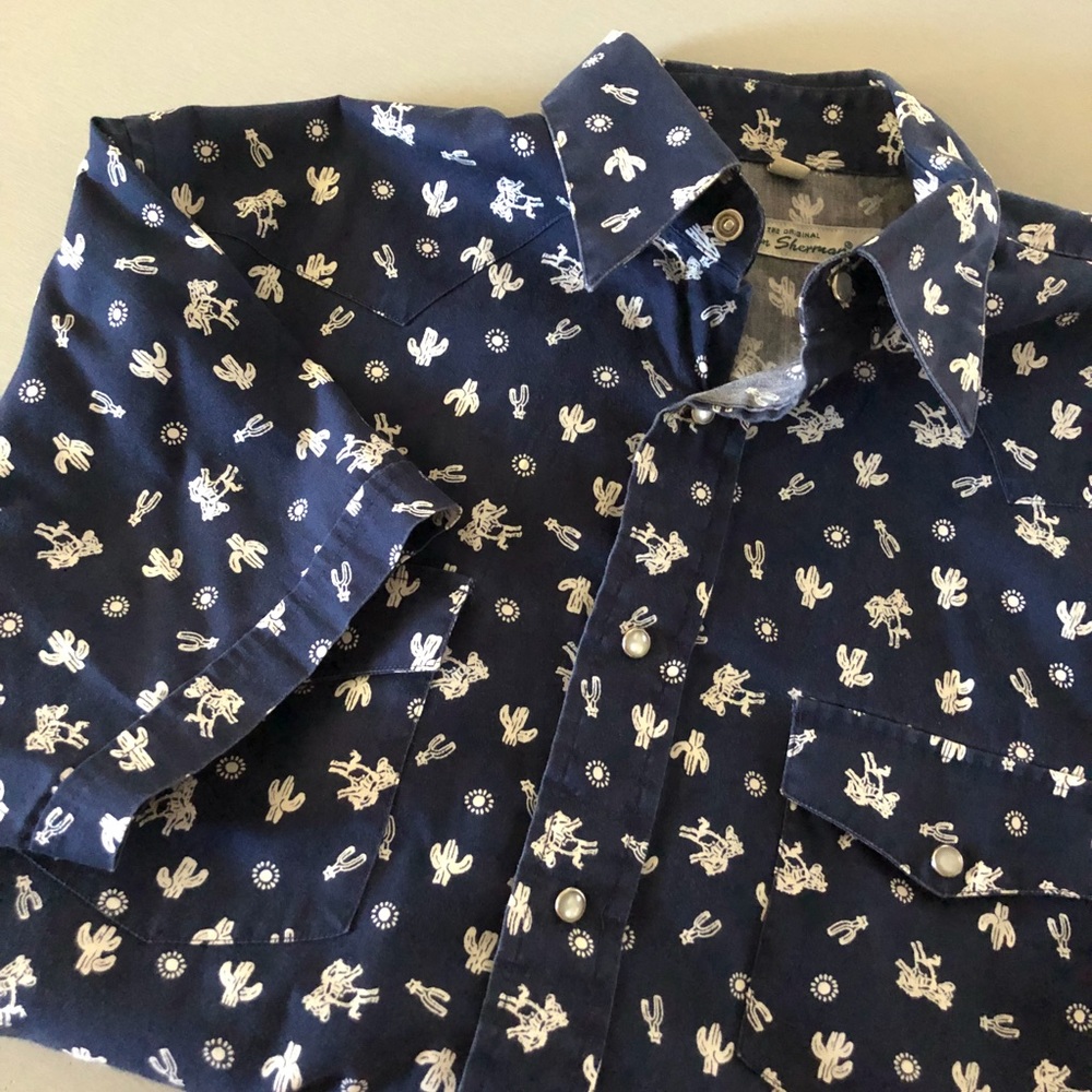 Blue, short sleeved shirt -cowboy print